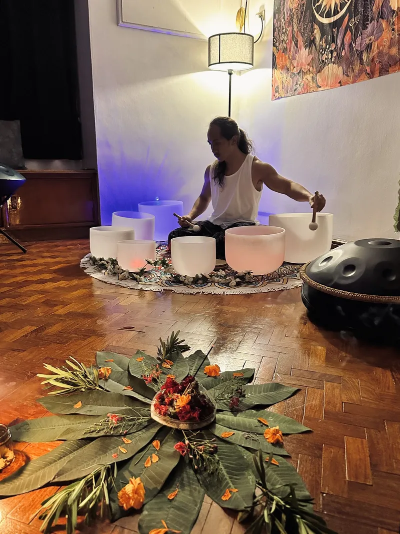 Private sound healing: crystal singing bowls arranged for a one-on-one rest session in warm light