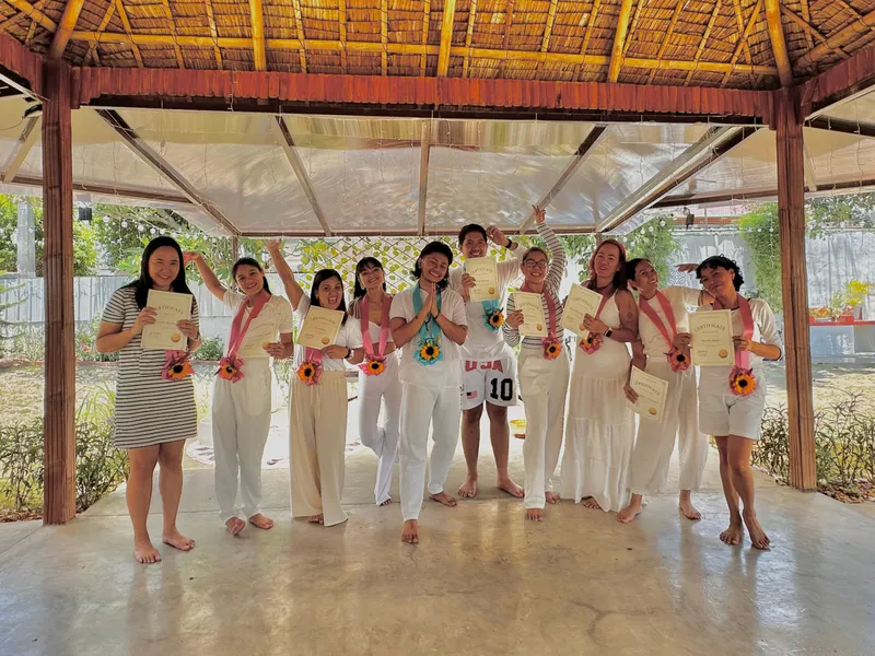Graduates of the 12-Week Mindful Happiness Program smiling together at Tallaro