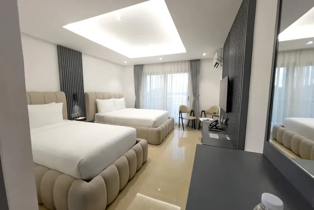 Shared hotel room with solo bed for retreat guests